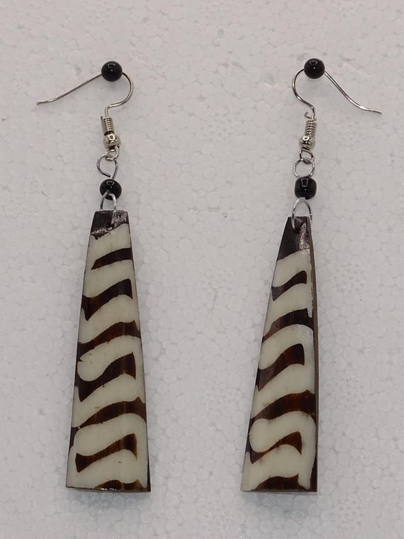 11 Bone, Horn and Brass Earrings.