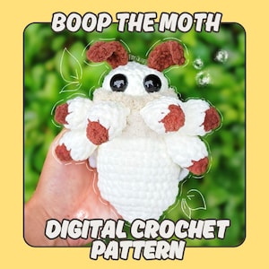 Peut inclure: Un jouet de papillon de nuit crocheté blanc avec des détails bruns, de grands yeux noirs et un col beige. L'image comprend le texte "BOOP THE MOTH" et "DIGITAL CROCHET PATTERN" sur un fond jaune avec un arrière-plan vert.