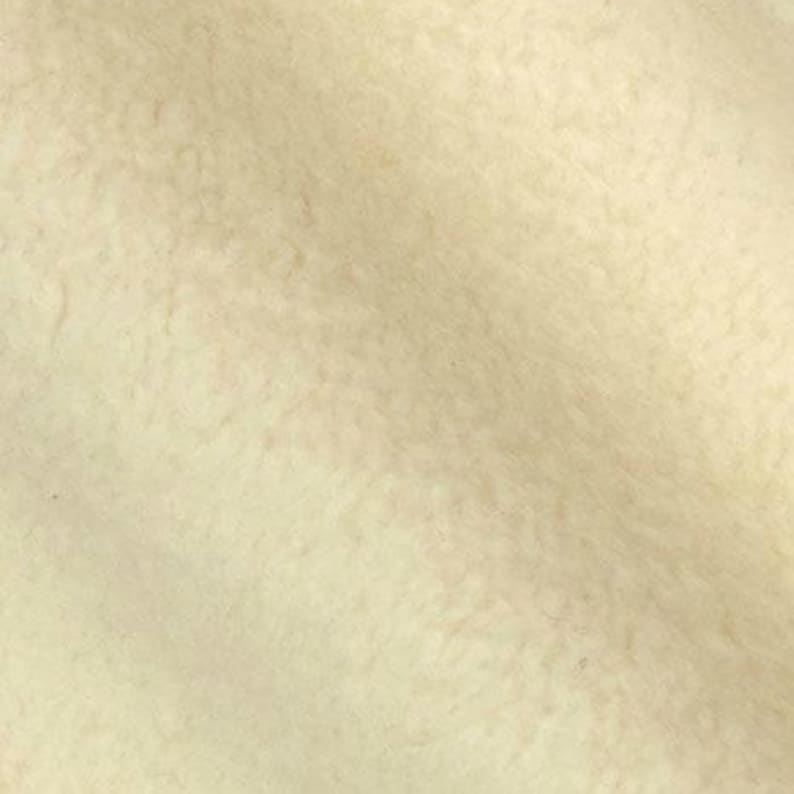 Puede incluir: Primer plano de una superficie texturizada de color blanquecino. La superficie tiene un patr&oacute;n sutil y desigual.