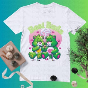 May include: White t-shirt with a graphic of two green cartoon bears smoking and the text "Best Buds" in pink letters.