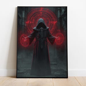 May include: A framed print featuring a robed figure with a hood, standing in a dark, gothic setting. The figure's hands are surrounded by glowing red energy circles. The artwork has a fantasy or occult theme.