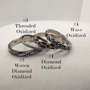 May include: Four silver rings with different oxidized designs. The rings are labeled #1 Diamond Oxidized, #2 Woven Diamond Oxidized, #3 Threaded Oxidized, and #4 Wave Oxidized.