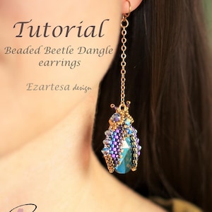 May include: Beaded beetle dangle earrings tutorial by Ezartesa design. The earrings feature a blue, purple, and gold beetle charm with a gold chain.
