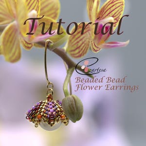 May include: A tutorial for beaded flower earrings. The earrings are made with small purple, gold, and orange beads and a white pearl. The earrings are hanging from a gold wire and are shown against a background of a yellow orchid.