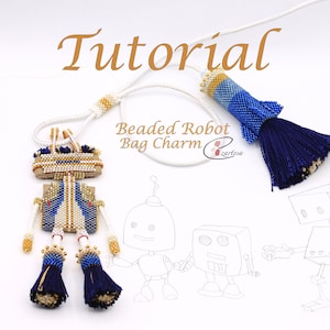 Könnte beinhalten: Anleitung für einen geperllten Roboter-Taschenanhänger. Der Anhänger ist blau, weiß und gold mit einem blauen Quasten. Die Anleitung enthält eine Skizze eines Roboters.