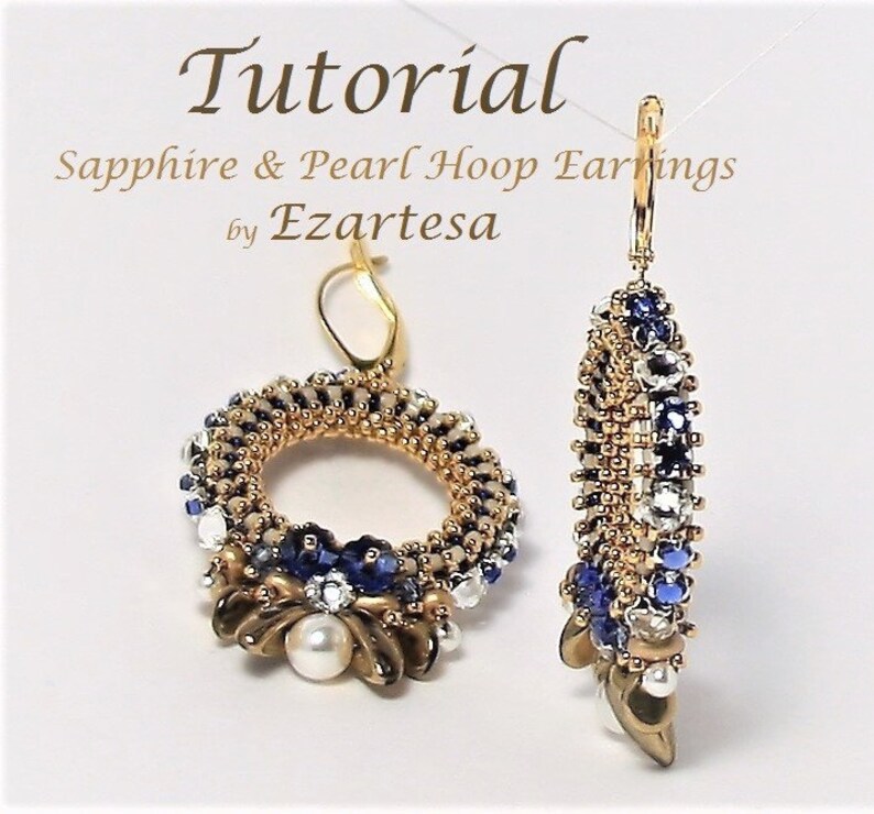 May include: A pair of gold hoop earrings with blue and white beads, a pearl, and a gold hook closure. The earrings are called "Sapphire & Pearl Hoop Earrings by Ezartesa".