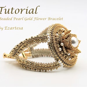 May include: A gold beaded bracelet featuring a pearl flower design. The bracelet is crafted with small gold beads and white pearls. The flower is positioned centrally on the bracelet and has a large pearl at its heart. The bracelet is a tutorial by Ezartesa.
