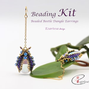 May include: A pair of beaded beetle dangle earrings. The earrings are made with purple, blue, and gold beads. The text "Beading Kit" and "Beaded Beetle Dangle Earrings" are displayed in purple font.