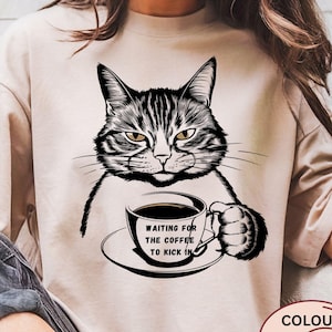 Funny Cat Coffee T-Shirt, Waiting for the Coffee to Kick In Shirt, Caffeine Lover Gift, Sarcastic Cat Tee, Coffee Humor for Women