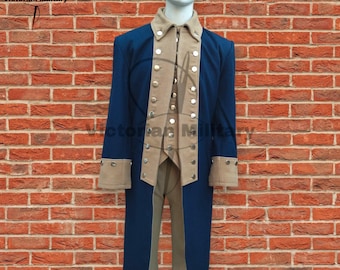 May include: A navy blue military-style coat with tan accents, including the collar, cuffs, and vest. The coat features multiple silver buttons and is displayed on a mannequin. The text "Victorian Military" is visible in the upper left corner.