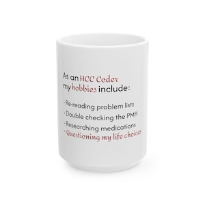 May include: White ceramic mug with the text "As an HCC Coder my hobbies include: Re-reading problem lists, Double checking the PMH, Researching medications, Questioning my life choices" in black and red font.