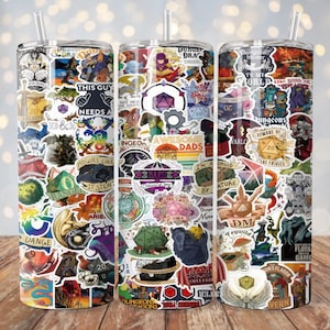 May include: Three stainless steel tumblers with a colorful collage of Dungeons and Dragons themed stickers. The stickers feature dice, dragons, and other fantasy imagery.