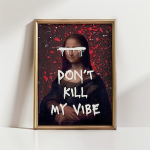 May include: Framed art print featuring a graffiti-style Mona Lisa portrait. The artwork has a red splatter background and white text that reads "DON'T KILL MY VIBE." The frame is gold-colored.