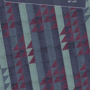 May include: A quilt pattern called "Jangle" by Tamarinis, featuring a geometric design of triangles in shades of blue and purple. The pattern is 48 inches by 60 inches.