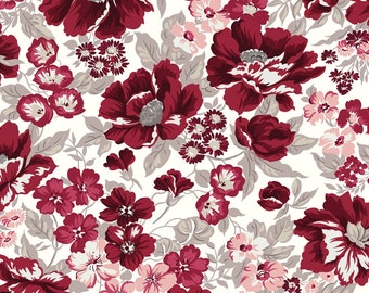 May include: A seamless pattern featuring a variety of red and pink flowers on a white background. The flowers are arranged in a random pattern and are surrounded by green leaves.