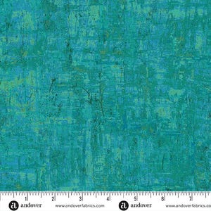 May include: Teal and blue abstract fabric with a textured design. The fabric has a distressed, painterly appearance with vertical and horizontal brushstroke-like patterns. The bottom edge features a ruler with centimetre measurements and the Andover Fabrics logo.