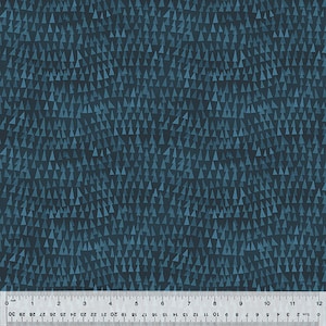 May include: Dark teal fabric with a repeating pattern of small, light blue triangles. The triangles are scattered across the surface, creating a textured appearance. A ruler is at the bottom, showing measurements in inches.
