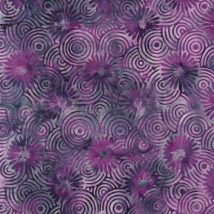 May include: A fabric with a repeating pattern of purple flowers and concentric circles in shades of purple and gray. The design has a batik-like appearance, with a textured, mottled effect. The overall theme is floral and abstract.