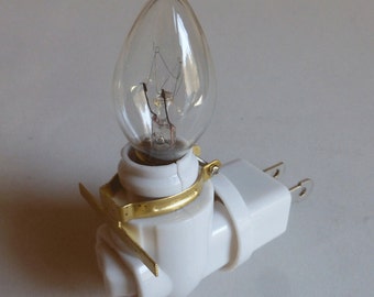 Rotating night light plug - bulb - brass clip