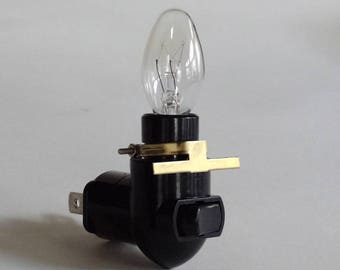 Rotating night light plug - black - 4 Watt bulb - brass clip