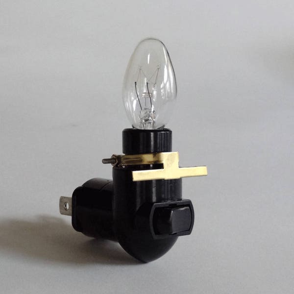Rotating night light plug - black - 4 Watt bulb - brass clip
