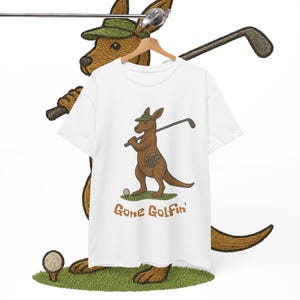 May include: White t-shirt with a cartoon kangaroo wearing a green hat and holding a golf club. The text "Gone Golfin'" is printed below the kangaroo. A golf ball and grass are also depicted.