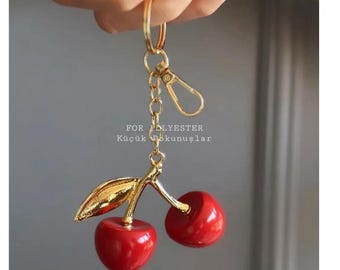 Kersensleutelhanger – glanzende fruitbedel, rood en goud accessoire