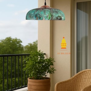 May include: A copper pendant light with a green verdigris finish hangs from a black cord. The outdoor setting includes a potted plant, a small table, and a wicker chair. The logo for ACHGALO Lighting is visible.