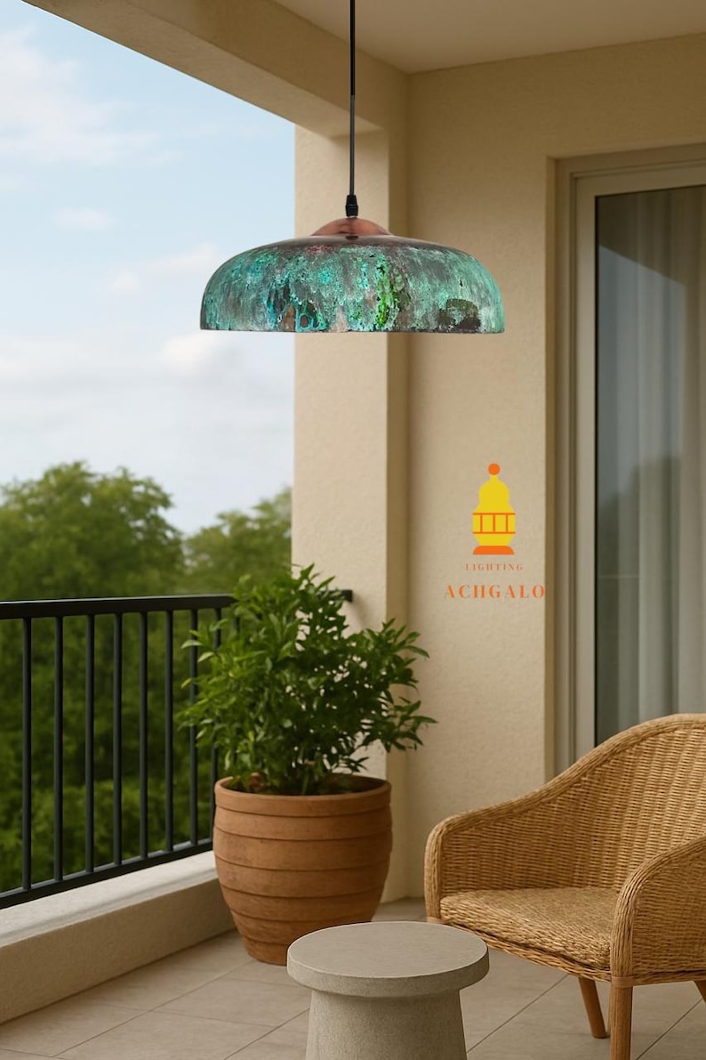 May include: A copper pendant light with a green verdigris finish hangs from a black cord. The outdoor setting includes a potted plant, a small table, and a wicker chair. The logo for ACHGALO Lighting is visible.