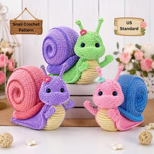 May include: Crocheted snail toys in various colors: purple, pink, green, and blue. Each snail has a spiral shell, a flower on its head, and big blue eyes. The image also includes a sign that says "Snail Crochet Pattern" and "US Standard".