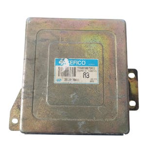 May include: A rectangular, metallic-coloured car engine control unit (ECU) with a blue and white label. The label includes the text "KEFICO KOREA", a barcode, and other alphanumeric codes. The ECU has mounting brackets.