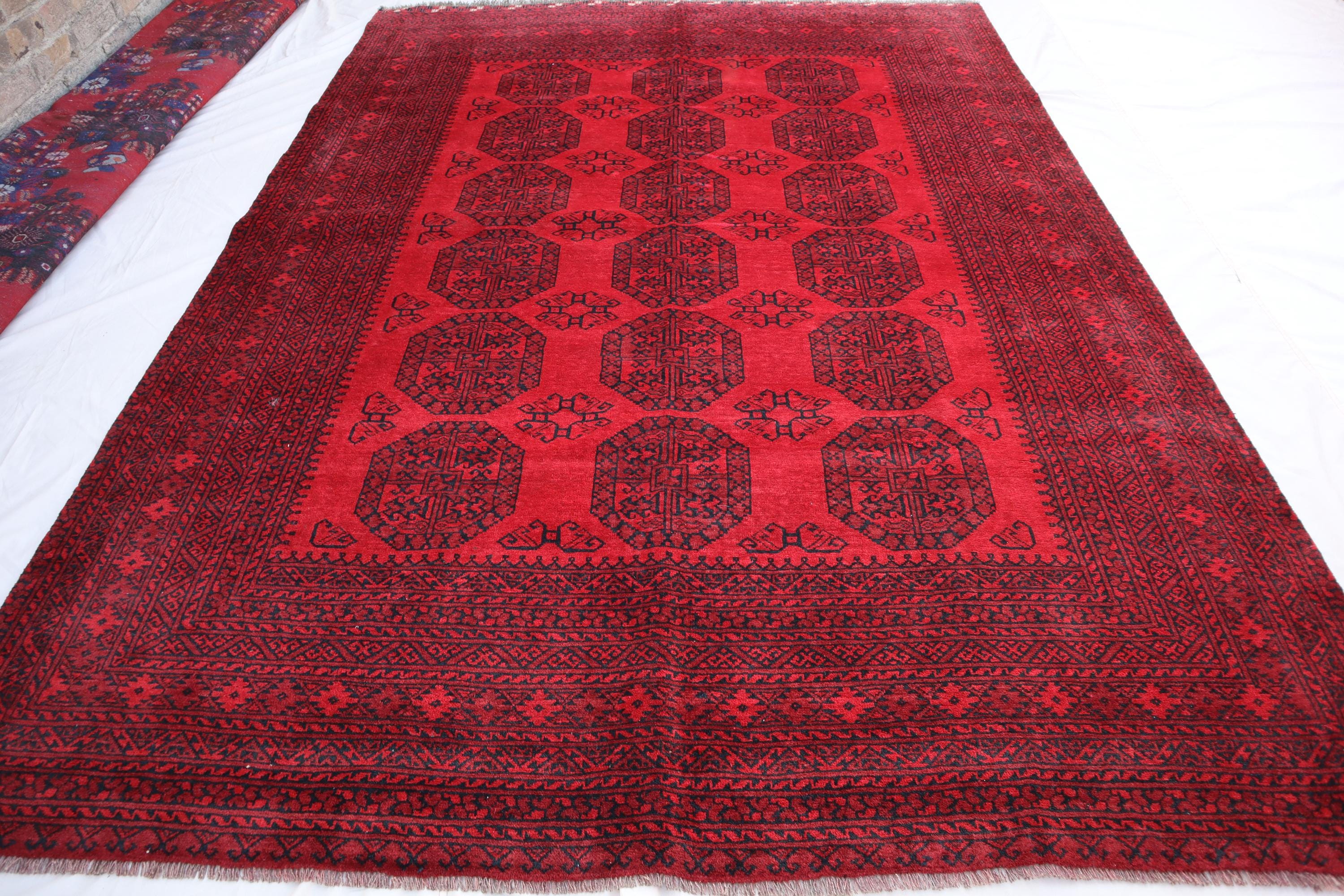 手織りトルクメンウールラグ：6x9 赤い象の足のデザイン - Etsy 日本