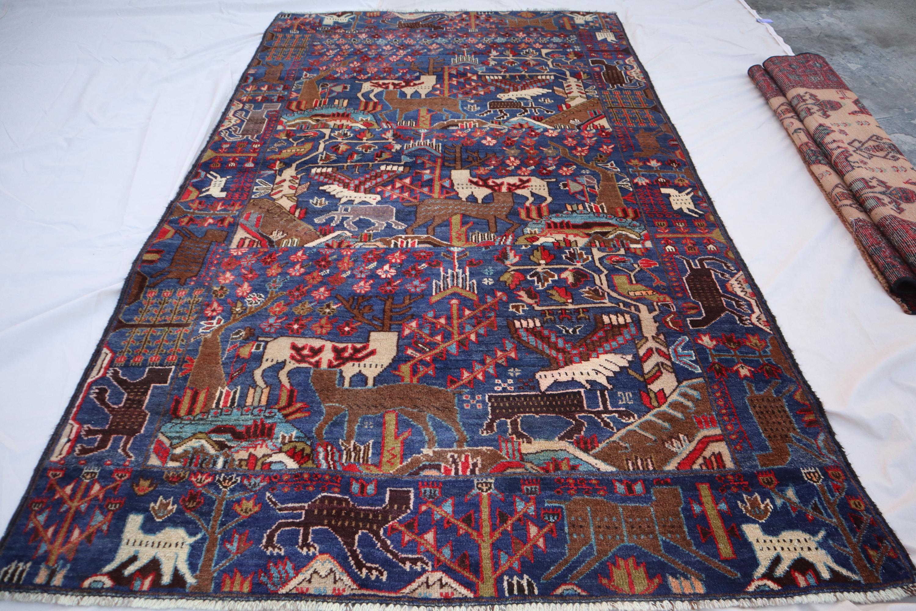 アフガニスタンの絵画的ラグ：4x7インチのヴィンテージ手織り