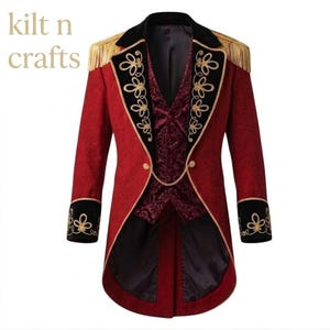 May include: A red tailcoat jacket featuring black velvet lapels and cuffs with gold embroidery, gold shoulder fringe, and a dark red patterned vest insert. A gold chain connects the front closure. The text kilt n crafts appears in the corner.