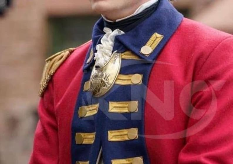 May include: A red military jacket with gold epaulets and gold buttons. The jacket has a navy blue collar and lapels with gold trim. A gold decorative piece is attached to the jacket.