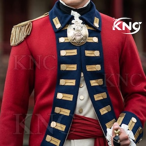 May include: A red military jacket with navy blue accents and gold buttons. The jacket features gold epaulettes and a large gold emblem. The cuffs have white lace trim. The jacket is part of a historical costume.