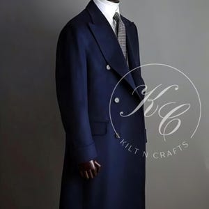 May include: A navy blue double-breasted overcoat with a long length and a single button closure at the top. The coat has a lapel collar and two pockets on the front.