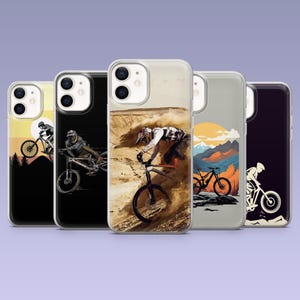 May include: Five phone cases with mountain biking illustrations. Each case displays a different design of cyclists on mountain bikes, with diverse backgrounds including landscapes and action shots of the sport.