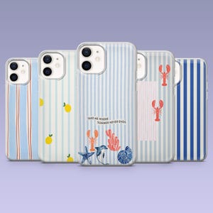 May include: A collection of phone cases with various designs. Some cases feature blue and white stripes, while others showcase lemons, lobsters, and marine life. One case has the text "TAKE ME WHERE SUMMER NEVER ENDS".