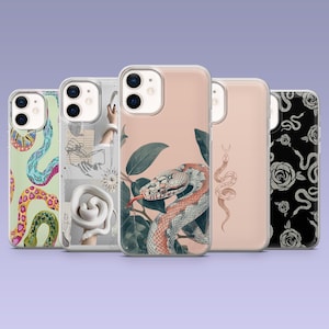 May include: Five different iPhone cases with various designs. The cases are clear and show a variety of patterns including snakes, flowers, and abstract designs.