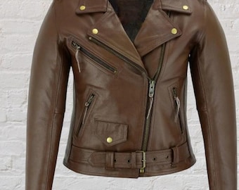 May include: A brown leather jacket with a classic biker style. Features include an asymmetrical zipper, multiple zippered pockets, a belted waist, and gold-colored hardware. The jacket has a notched collar and epaulets on the shoulders.
