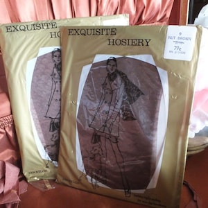 May include: Two packages of Exquisite Hosiery, one in brown and one in beige, with a woman in a dress and a dog on each package. The brown package has a price tag that says "79¢" and "Nut Brown".