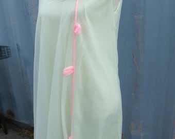 May include: A light green sheer nightgown with a pink ribbon and pom-poms.