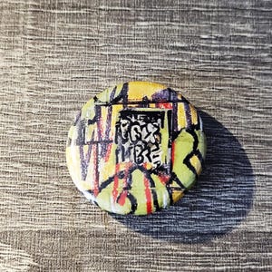 May include: A set of three ceramic mugs with a speckled, matte finish. The mugs are in shades of cream, light gray, and dark gray. Each mug has a simple, minimalist design, perfect for coffee or tea.