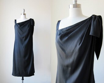 vintage black cocktail dress | 1960s short malcolm star | sleeveless bow evening dress || small | s