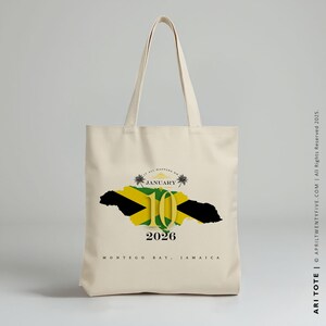 May include: A beige tote bag with a graphic of the Jamaican flag and the text "January 10, 2026, Montego Bay, Jamaica".