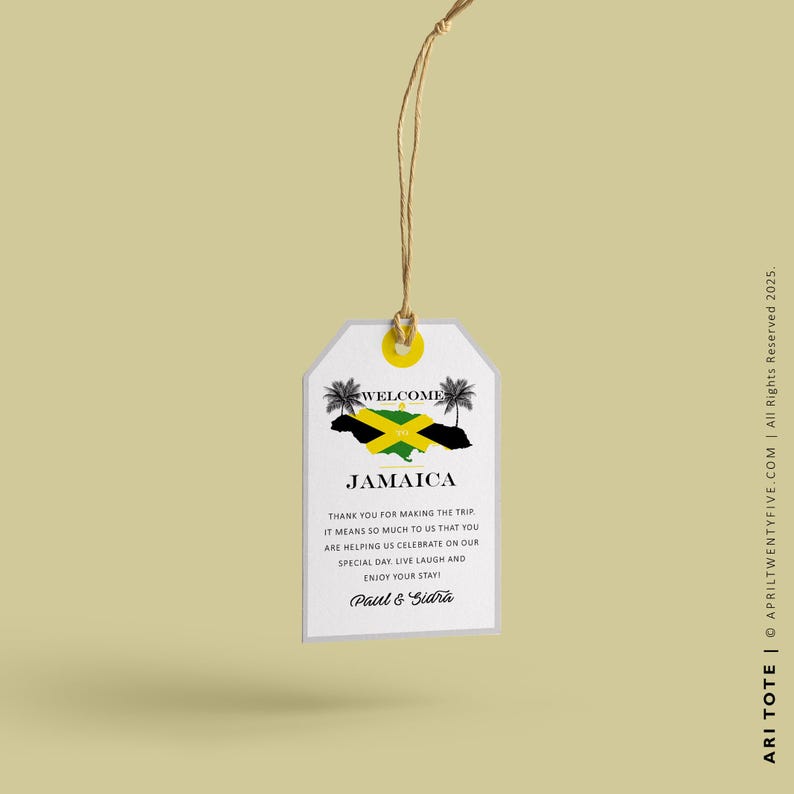 May include: A white welcome tag with a string attached. The tag features a Jamaican flag and the text "Welcome Jamaica". The text below the flag reads "Thank you for making the trip. It means so much to us that you are helping us celebrate on our special day. Live, laugh and enjoy your stay! Paul & Sidra"