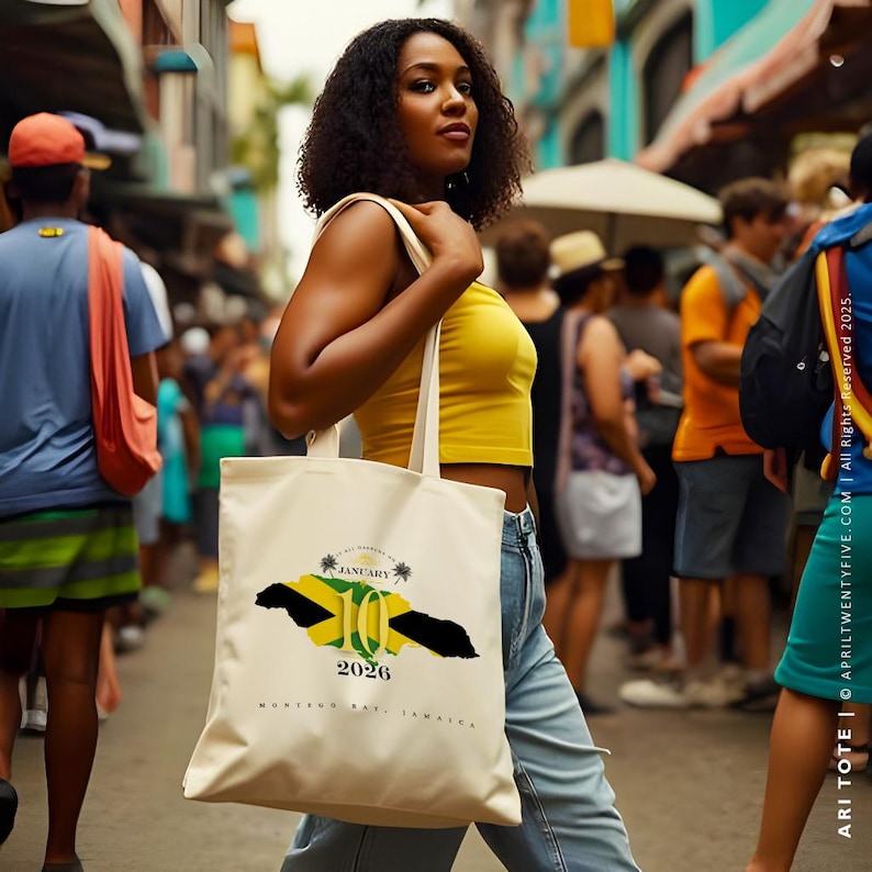 May include: A white tote bag with a graphic of the Jamaican flag and the text "January 10, 2026, Montego Bay, Jamaica".