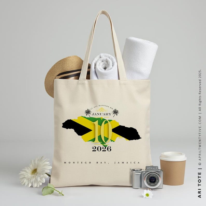May include: A white canvas tote bag with a graphic of the Jamaican flag and the text "It all happens on January 10, 2026, Montego Bay, Jamaica".
