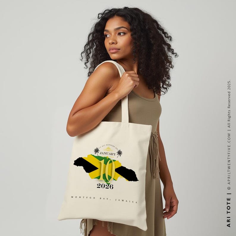 May include: A white tote bag with a design featuring the Jamaican flag, palm trees, and the text "January 10, 2026, Montego Bay, Jamaica".